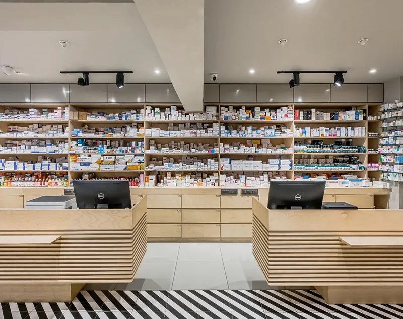 ONI Display Minimalist Wooden Counters and Grid-Style Pharmacy Layout for Efficient Medical Shop Interior